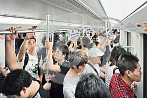 People packed in a train car, Shanghai, China