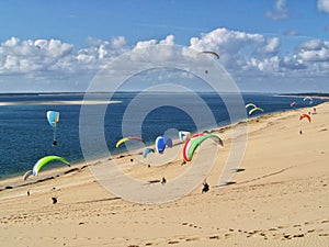 People paragliding at the Great Dune of Pilat, France