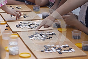 People participate in the go game photo