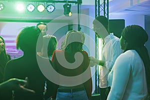 People partying at dj concert in club