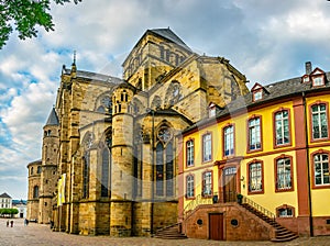 People are passing by the Cathedral in Trier, Germany