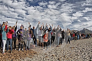 People in a peaceful demonstration on a beach to protect it from construction