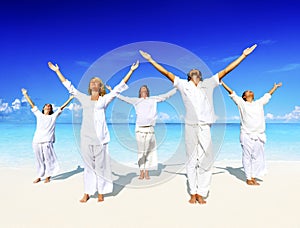 People performing yoga on the beach Concept