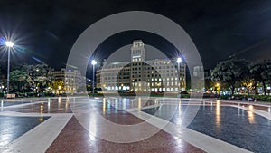 People at Placa de Catalunya or Catalonia Square night timelapse hyperlapse a large square in central Barcelona photo