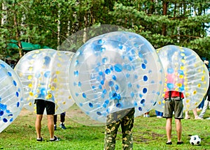 People play bumperball outdoor, Zorbsoccer