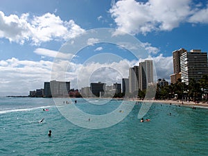 People play in the protected water and hang out on the beach in