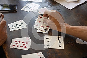 People playing card game card Detail