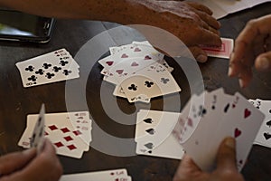 People playing card game card Detail