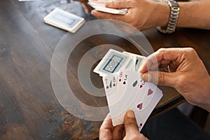 People playing card game card Detail