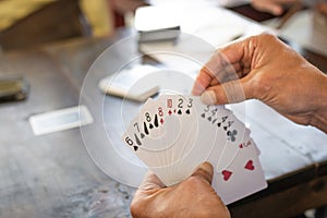 People playing card game card Detail