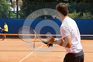 People, playing and competition on tennis court, athlete and action with ball to score. Opponent, intensity and training