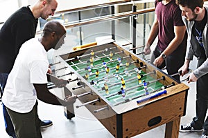 People Playing Enjoying Foosball Table Soccer Game Recreation Le