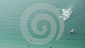 People are playing a jet ski in the sea. Aerial view. Jet boats in the ocean