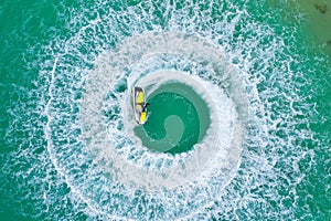 People are playing a jet ski in the sea.Aerial view. Top view.amazing nature background.The color of the water and beautifully