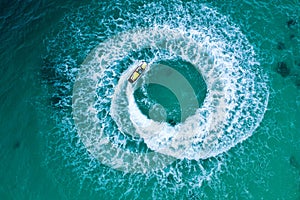 People are playing a jet ski in the sea.Aerial view. Top view.amazing nature background. The color of the water and beautifully