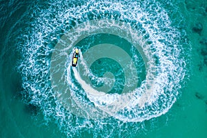 People are playing a jet ski in the sea.Aerial view. Top view.amazing nature background. The color of the water and beautifully