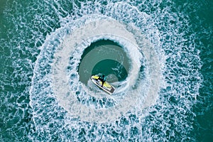 People are playing a jet ski in the sea.Aerial view. Top view.amazing nature background. The color of the water and beautifully