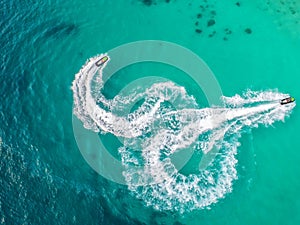 People are playing a jet ski in the sea.Aerial view. Top view.amazing nature background.The color of the water and beautifully br