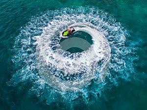 People are playing jet ski at sea during the holidays.