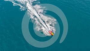 People are playing jet ski at sea during the holidays. Aerial vi