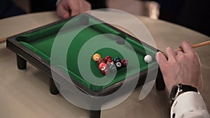 People playing table billiard