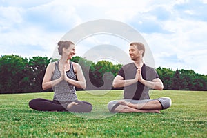 People practice acro yoga outdoors healthy lifestyle