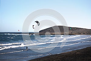 People practicing Kitesurfing at El Medano Beach in Santa Cruz de Tenerife