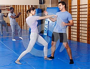 People practicing self defense techniques