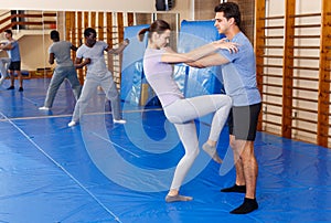 People practicing self defense techniques