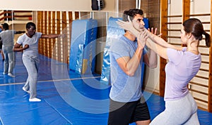 People practicing self defense techniques