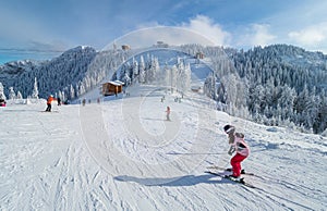 People practicing ski in Poiana Brasov, Romania