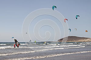 People practicing watersports on a perfect windy day at El Medano, Tenerife, Canary Islands, Spain