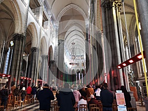 People praying during mass in the Interior of the Cathedral of Lille or Notre Dame de la Treille Cathedral