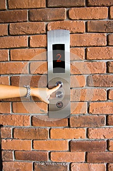 People pressing elevator button