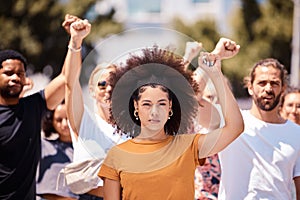 People protest for freedom, support fist for climate change or black power empowerment in Los Angeles. Young woman