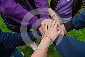 People put their hands together. Selective focus