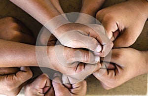 people putting their hands together ,concept successful people or team work