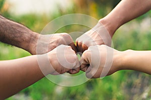 People putting their hands together. Friends making group fist bump. unity and teamwork. Friendship happiness leisure partnership