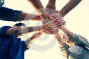 People putting their hands together. Friends with stack of hands showing unity and teamwork. Friendship happiness leisure