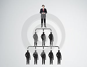 People pyramid with leader in red tie