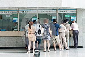 People in the queue at the windows of the hospital