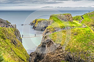 People queueing to crossing Carrick a Rede rope bridge to access island, Northern Ireland