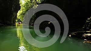 People Rafting In Rubber Rowing Boats in Natural Canyon. Beautiful River Among Cliffs 25 fps