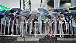 People in rain in beijing