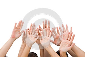 People raising hands in the air