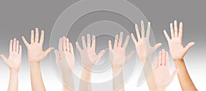 People raising hands for participation, many people`s hands up. teamwork and competition concept