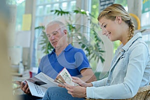 People reading in waiting room