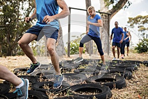 People receiving tire obstacle course training