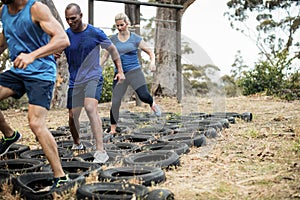 People receiving tire obstacle course training
