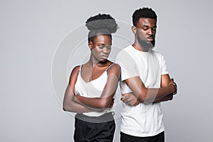 People, relationship difficulties, conflict and family concept - unhappy african couple having argument isolated on white